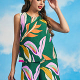 Woman styling colorful abstract print shell top with flowing palazzo pants