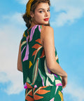 Back view of sleeveless tropical print blouse with keyhole button closure