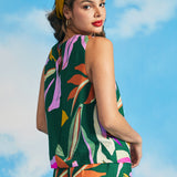 Back view of sleeveless tropical print blouse with keyhole button closure