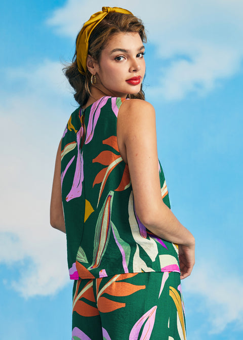 Back view of sleeveless tropical print blouse with keyhole button closure