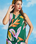 Woman wearing retro-inspired tropical print shell top with relaxed silhouette