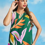 Woman wearing retro-inspired tropical print shell top with relaxed silhouette