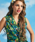 Close-up of jungle animal and tropical foliage novelty print on cotton shirt