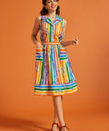 Woman wearing a colorful striped rainbow skirt with matching sleeveless blouse