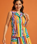 Woman wearing a colorful striped rainbow blouse