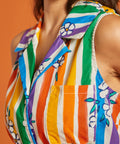 Close up of colorful striped shirt with floral patterns, chest pocket, and collar