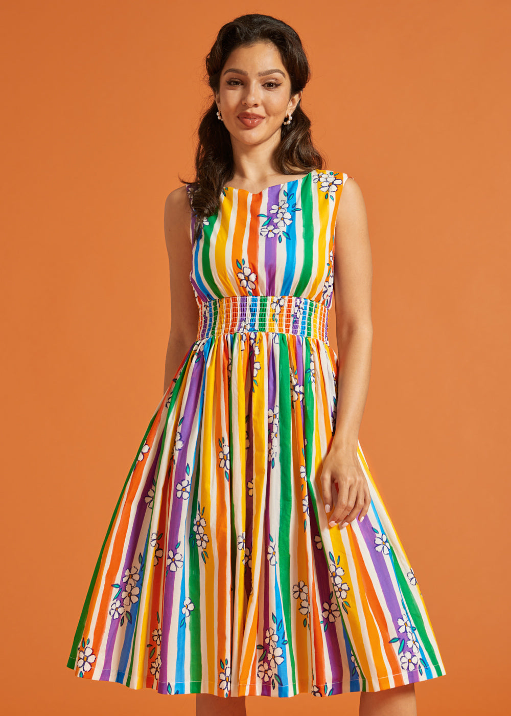Woman modeling a rainbow stripe fit and flare casual dress