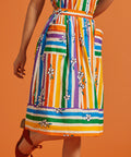 Colorful striped skirt with floral patterns on an orange background