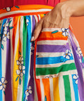 Colorful rainbow striped skirt with floral patterns and pockets