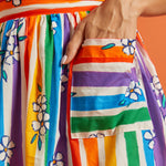 Colorful rainbow striped skirt with floral patterns and pockets