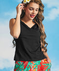 Woman modeling a black stretch knit sleeveless top with a soft boatneck neckline