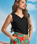 Detailed view of the soft folded boatneck neckline on a black sleeveless top