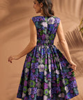 Back view of black floral midi dress with smocked waistband