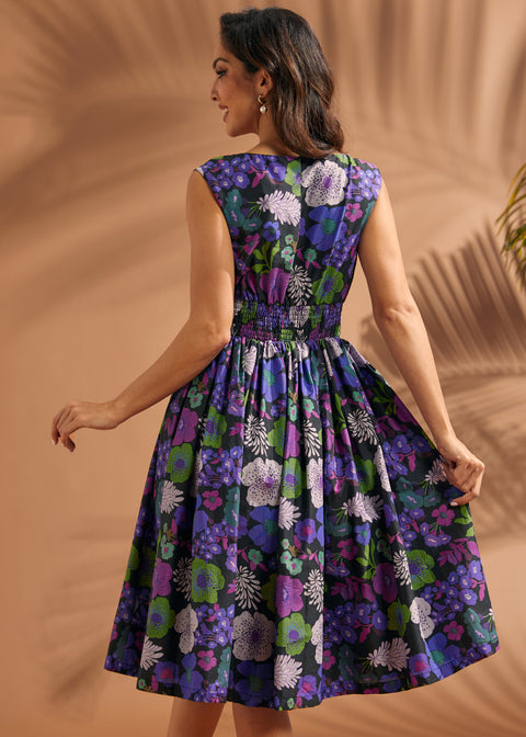 Back view of black floral midi dress with smocked waistband