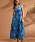 Full-length view of blue tiered maxi dress with tropical abstract print