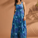 Full-length view of blue tiered maxi dress with tropical abstract print