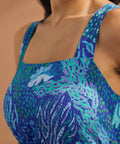 Close-up of square neckline and blue reef-inspired print on maxi dress