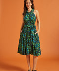 Full-length view of dark floral midi dress with gathered skirt