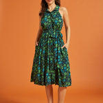 Full-length view of dark floral midi dress with gathered skirt
