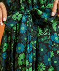 Close-up of green floral print fabric and self-tie waist belt