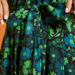 Close-up of green floral print fabric and self-tie waist belt