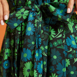 Close-up of green floral print fabric and self-tie waist belt