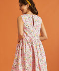 Back view of pink fruit print cotton swing dress with keyhole closure