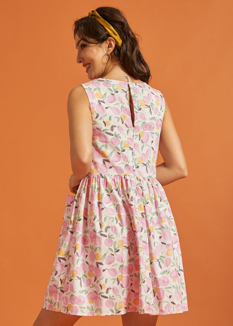 Back view of pink fruit print cotton swing dress with keyhole closure