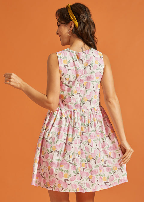 Woman wearing a floral dress against an orange background