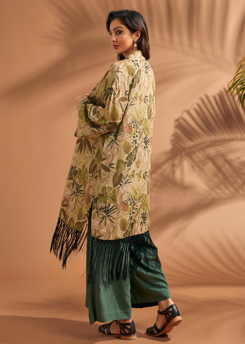 Back view of tropical print duster showcasing allover botanical and leopard motif.