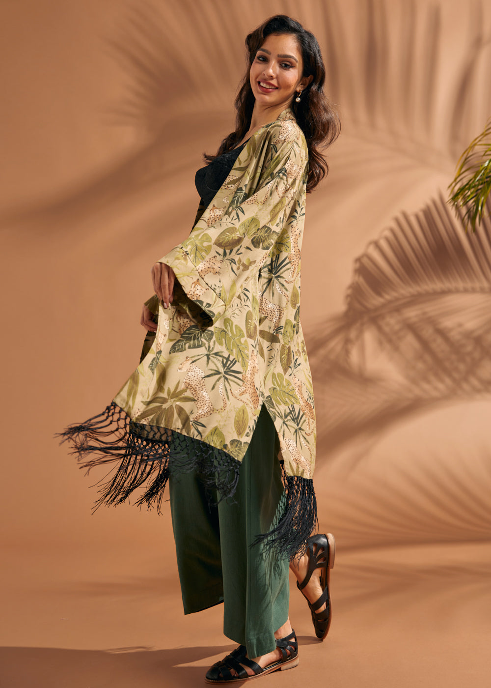 Side view of lightweight open-front fringe duster with tropical foliage print.