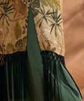 Close-up of black fringe trim and side slit on tropical print duster.