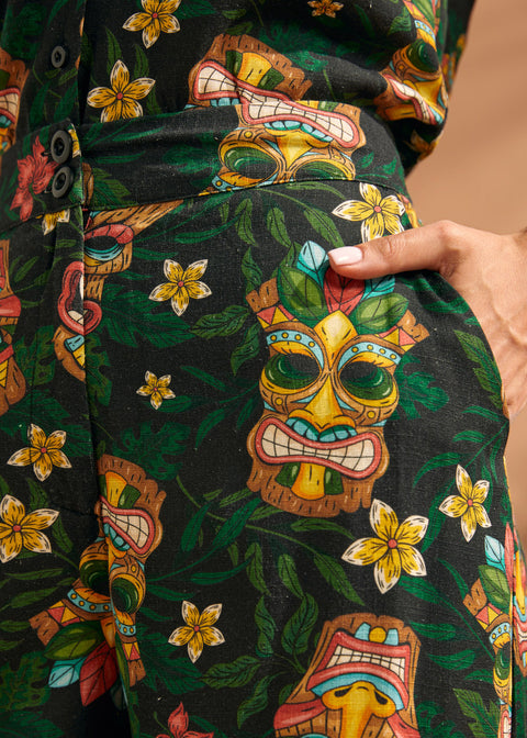 Detail of functional side pocket on tropical novelty print wide leg trousers.
