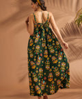 Back view of women's tiki print maxi dress with oversized self-tie bow detail.