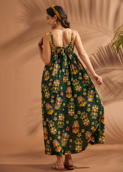 Back view of women's tiki print maxi dress with oversized self-tie bow detail.