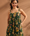 Front view of tiki print linen blend maxi dress with side pockets.