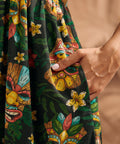 Close-up of functional side pocket on tropical tiki print maxi dress.