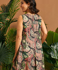 Back view of the sleeveless jungle print A-line dress with clean lines and mini length.