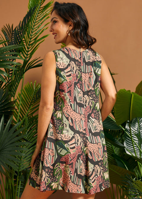 Back view of the sleeveless jungle print A-line dress with clean lines and mini length.