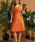 Vintage-inspired A-line wrap skirt with self-tie belt and botanical print.