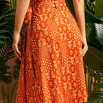 Back view showing wrap overlap and self-tie belt on midi skirt.
