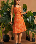 Full outfit featuring a retro orange cotton cami and coordinating wrap skirt.