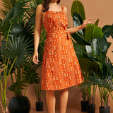 Full outfit featuring a retro orange cotton cami and coordinating wrap skirt.