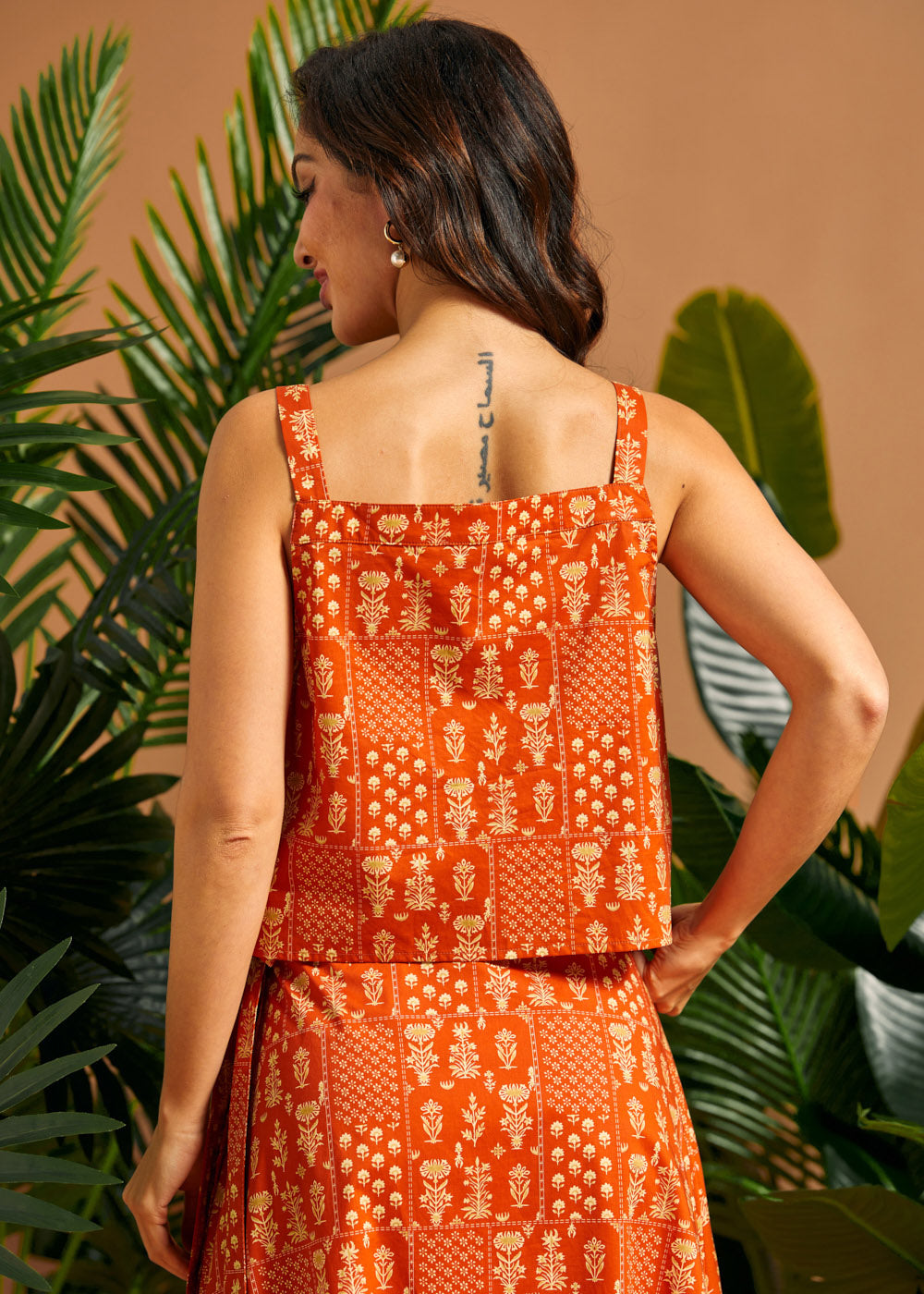 Back view of a vintage-inspired square neck cotton camisole.