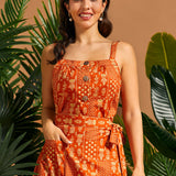 Woman wearing a cropped cotton camisole with gathered neckline and oversized buttons.