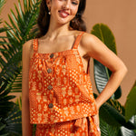 Front view of retro orange square neck cami paired with a coordinating wrap skirt.