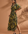 Three-quarter view of a woman wearing a vintage-inspired flutter sleeve maxi dress in a jungle print.