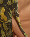Close-up of the side slit on a lightweight tropical print maxi dress.