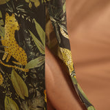 Close-up of the side slit on a lightweight tropical print maxi dress.