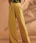 Woman wearing vintage-inspired high waisted palazzo pants with wide legs.